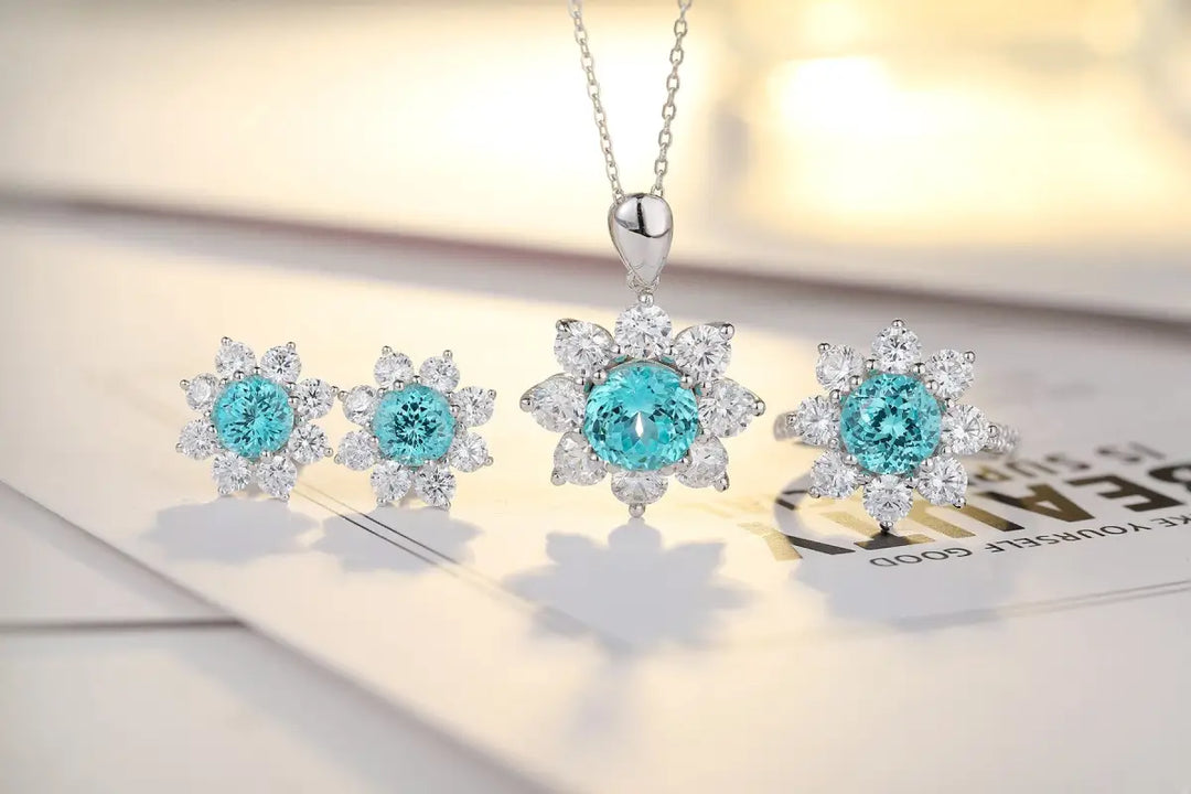 Jewelry set featuring aquamarine and diamond snowflake-shaped pieces.