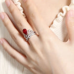 Load image into Gallery viewer, Elegant ring featuring a red gemstone and diamond-like accents.
