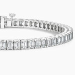 Load image into Gallery viewer, Diamond tennis bracelet featuring emerald-cut stones set in a line.
