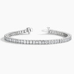 Load image into Gallery viewer, Diamond tennis bracelet with square-cut stones set in a silver or white gold band.
