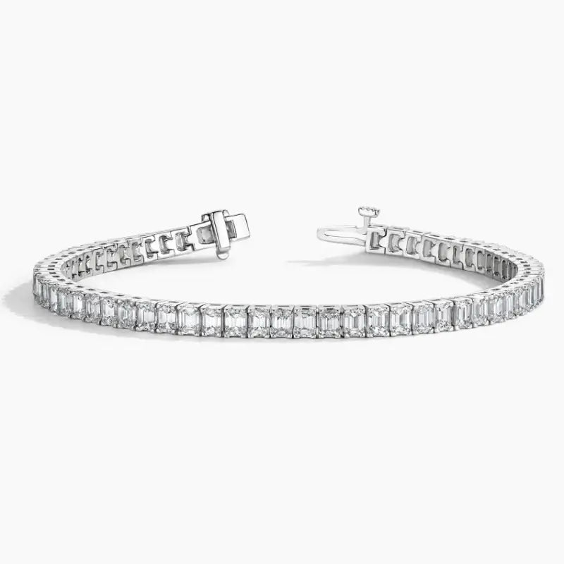 Diamond tennis bracelet with square-cut stones set in a silver or white gold band.