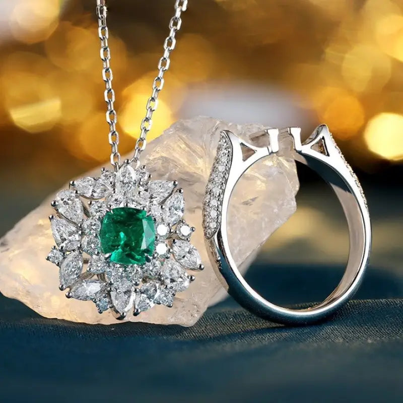 Emerald and diamond pendant necklace with matching ring.