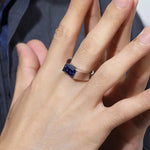 Load image into Gallery viewer, Sapphire ring on a person’s hand.
