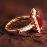 Load image into Gallery viewer, Gold ring with a prominent rectangular red gemstone and small diamonds along the band.
