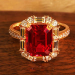 Load image into Gallery viewer, Ornate gold ring featuring a prominent square-cut ruby surrounded by diamonds.
