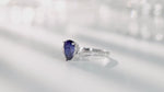 Load and play video in Gallery viewer, V-Shaped 1.65 Ct Pear Lab Blue Sapphire Half Pave Solitaire Engagement Ring
