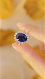 Load and play video in Gallery viewer, 8.5 Ct Oval Cut Lab Blue Sapphire Halo Engagement Ring
