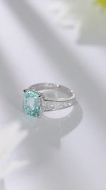 Load and play video in Gallery viewer, 6.5 Ct Cushion Shape Lab Paraiba Four Prongs Graduating Pave Engagement Ring
