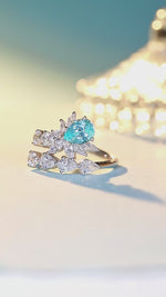 Load and play video in Gallery viewer, Pear Cut Lab Paraiba Crossover Engagement Ring
