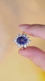 Load and play video in Gallery viewer, 4 Ct Oval Cut Lab Blue Sapphire Cluster Engagement Ring
