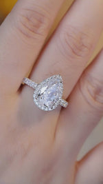 Load and play video in Gallery viewer, 3 Ct Pear Shape Lab Diamond Halo Half Pave Engagement Ring
