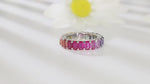 Load and play video in Gallery viewer, Graduating Pink Sapphire Four Prongs Eternity Band
