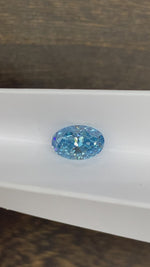 Load and play video in Gallery viewer, 3.468 Ct Oval Cut Fancy Blue Lab Diamond VS1
