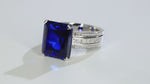 Load and play video in Gallery viewer, Luxury Triple Split Shank 13 Ct Emerald Cut Lab Blue Sapphire Engagement Ring
