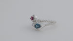 Load and play video in Gallery viewer, Pear Cut Blue Topaz &amp; Garnet Toi Et Moi Ring
