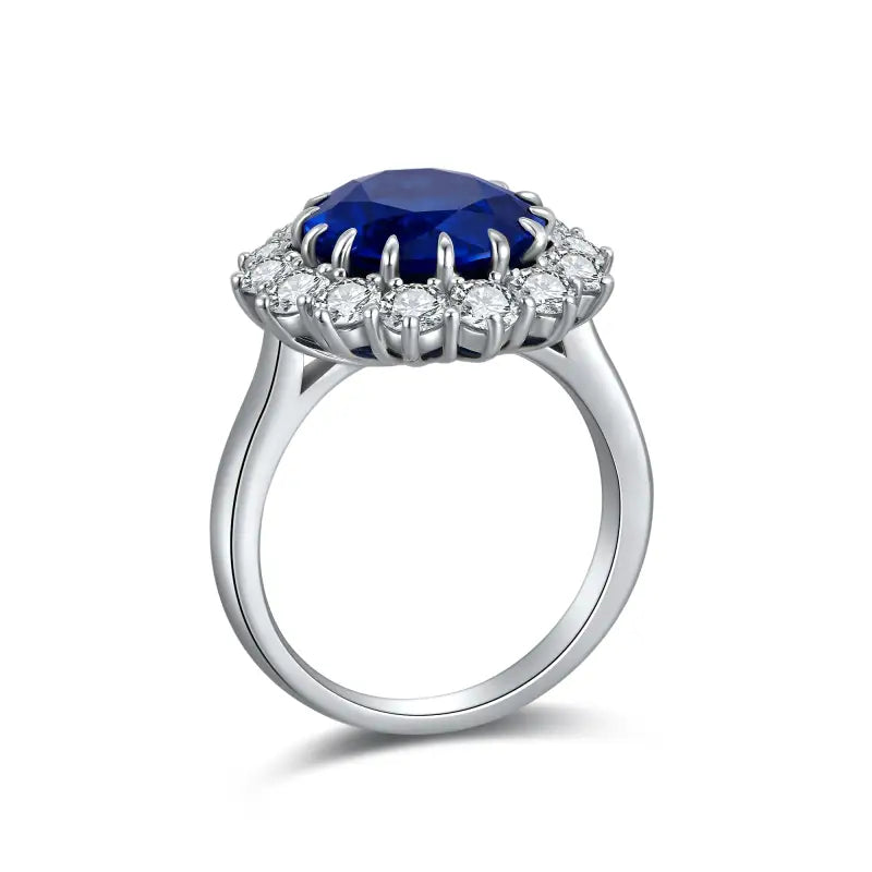 Elegant silver ring featuring a deep blue oval gemstone surrounded by smaller white stones.