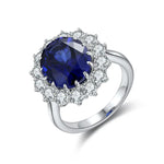 Load image into Gallery viewer, Sapphire and diamond ring with a silver band.
