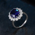 Load image into Gallery viewer, Sapphire and diamond ring with a silver band.
