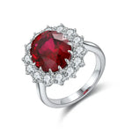 Load image into Gallery viewer, Ruby and diamond engagement ring with a silver band.
