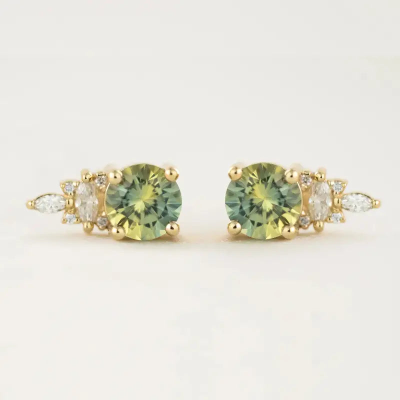 Pair of gold stud earrings featuring green gemstones and small diamonds.