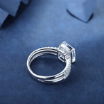 Load image into Gallery viewer, Diamond engagement ring with a square-cut center stone and pave band.
