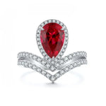 Load image into Gallery viewer, Elegant ring featuring a pear-shaped ruby surrounded by diamonds in a chevron setting.
